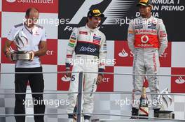 The podium (L to R): Phil Prew (GBR) McLaren Race Engineer; Sergio Perez (MEX) Sauber C31, second; Lewis Hamilton (GBR) McLaren, race winner. 09.09.2012. Formula 1 World Championship, Rd 13, Italian Grand Prix, Monza, Italy, Race Day