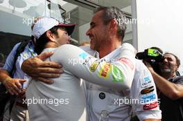 (L to R): Sergio Perez (MEX) Sauber celebrates his second position with Beat Zehnder (SUI) Sauber F1 Team Manager. 09.09.2012. Formula 1 World Championship, Rd 13, Italian Grand Prix, Monza, Italy, Race Day