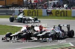 Kimi Raikkonen, Lotus Renault F1 Team and Sergio Perez (MEX), Sauber F1 Team  09.09.2012. Formula 1 World Championship, Rd 13, Italian Grand Prix, Monza, Italy, Race Day