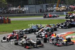 Sebastian Vettel (GER) Red Bull Racing RB8; Kimi Raikkonen (FIN) Lotus F1 E20; Fernando Alonso (ESP) Ferrari F2012 and Kamui Kobayashi (JPN) Sauber C31 at the start of the race. 09.09.2012. Formula 1 World Championship, Rd 13, Italian Grand Prix, Monza, Italy, Race Day