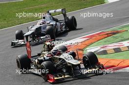 Kimi Raikkonen (FIN) Lotus F1 E20 leads Kamui Kobayashi (JPN) Sauber C31. 09.09.2012. Formula 1 World Championship, Rd 13, Italian Grand Prix, Monza, Italy, Race Day