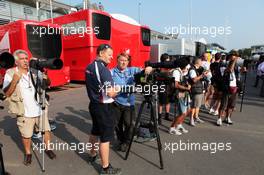 Photographers in the paddock. 08.09.2012. Formula 1 World Championship, Rd 13, Italian Grand Prix, Monza, Italy, Qualifying Day