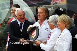 Alberto Bombassei (ITA) Brembo CEO presents Bernie Ecclestone (GBR) CEO Formula One Group (FOM) with a special Brembo brake to commemorate the 50th anniversary of the company. 08.09.2012. Formula 1 World Championship, Rd 13, Italian Grand Prix, Monza, Italy, Qualifying Day