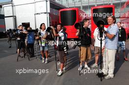 Photographers in the paddock. 08.09.2012. Formula 1 World Championship, Rd 13, Italian Grand Prix, Monza, Italy, Qualifying Day