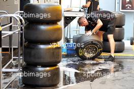 Lotus F1 Team wash their Pirelli tyres. 08.09.2012. Formula 1 World Championship, Rd 13, Italian Grand Prix, Monza, Italy, Qualifying Day