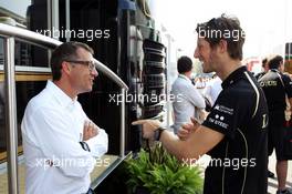 (L to R): Eric Lux (BEL) Genii Capital CEO with Romain Grosjean (FRA) Lotus F1 Team, serving a one race ban. 09.09.2012. Formula 1 World Championship, Rd 13, Italian Grand Prix, Monza, Italy, Race Day