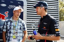 (L to R): Mikko Hirvonen (FIN) Rally Driver with Sebastian Vettel (GER) Red Bull Racing. 09.09.2012. Formula 1 World Championship, Rd 13, Italian Grand Prix, Monza, Italy, Race Day