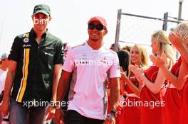 (L to R): Vitaly Petrov (RUS) Caterham and Lewis Hamilton (GBR) McLaren on the drivers parade. 09.09.2012. Formula 1 World Championship, Rd 13, Italian Grand Prix, Monza, Italy, Race Day