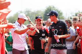 (L to R): Michael Schumacher (GER) Mercedes AMG F1 with Timo Glock (GER) Marussia F1 Team and Sebastian Vettel (GER) Red Bull Racing on the drivers parade. 09.09.2012. Formula 1 World Championship, Rd 13, Italian Grand Prix, Monza, Italy, Race Day