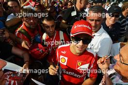 Felipe Massa (BRA) Ferrari signs autographs for the fans. 06.09.2012. Formula 1 World Championship, Rd 13, Italian Grand Prix, Monza, Italy, Preparation Day