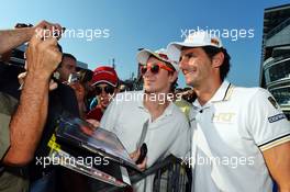 Pedro De La Rosa (ESP) HRT Formula 1 Team signs autographs for the fans. 06.09.2012. Formula 1 World Championship, Rd 13, Italian Grand Prix, Monza, Italy, Preparation Day