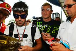 Fernando Alonso (ESP) Ferrari signs autographs for the fans. 06.09.2012. Formula 1 World Championship, Rd 13, Italian Grand Prix, Monza, Italy, Preparation Day