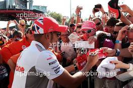 Lewis Hamilton (GBR) McLaren signs autographs for the fans. 06.09.2012. Formula 1 World Championship, Rd 13, Italian Grand Prix, Monza, Italy, Preparation Day