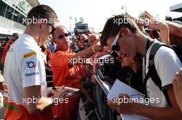 Paul di Resta (GBR) Sahara Force India F1 signs autographs for the fans. 06.09.2012. Formula 1 World Championship, Rd 13, Italian Grand Prix, Monza, Italy, Preparation Day