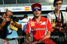 Fernando Alonso (ESP) Ferrari signs autographs for the fans. 06.09.2012. Formula 1 World Championship, Rd 13, Italian Grand Prix, Monza, Italy, Preparation Day