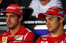 (L to R): Fernando Alonso (ESP) Ferrari and team mate Felipe Massa (BRA) Ferrari in the FIA Press Conference. 06.09.2012. Formula 1 World Championship, Rd 13, Italian Grand Prix, Monza, Italy, Preparation Day