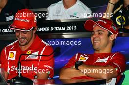 (L to R): Fernando Alonso (ESP) Ferrari and team mate Felipe Massa (BRA) Ferrari in the FIA Press Conference. 06.09.2012. Formula 1 World Championship, Rd 13, Italian Grand Prix, Monza, Italy, Preparation Day