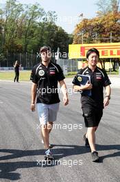 Jerome d'Ambrosio (BEL) Lotus F1 Team walks the circuit with Ayao Komatsu (JPN) Lotus F1 Team Race Engineer. 06.09.2012. Formula 1 World Championship, Rd 13, Italian Grand Prix, Monza, Italy, Preparation Day