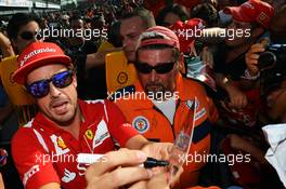 Fernando Alonso (ESP) Ferrari signs autographs for the fans. 06.09.2012. Formula 1 World Championship, Rd 13, Italian Grand Prix, Monza, Italy, Preparation Day