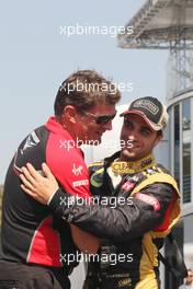 (L to R): Graeme Lowdon (GBR) Marussia F1 Team Chief Executive Officer with Jerome d'Ambrosio (BEL) Lotus F1 Team. 06.09.2012. Formula 1 World Championship, Rd 13, Italian Grand Prix, Monza, Italy, Preparation Day