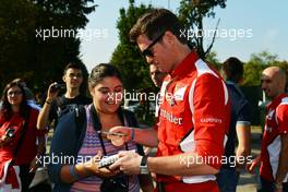 Rob Smedley (GBR) Ferrari Race Engineer signs autographs for the fans. 06.09.2012. Formula 1 World Championship, Rd 13, Italian Grand Prix, Monza, Italy, Preparation Day