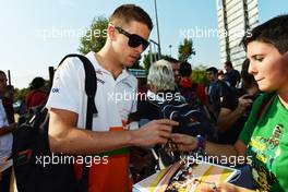 Paul di Resta (GBR) Sahara Force India F1 signs autographs for the fans. 06.09.2012. Formula 1 World Championship, Rd 13, Italian Grand Prix, Monza, Italy, Preparation Day
