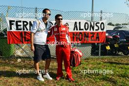 Andrea Stella (ITA) Ferrari Race Engineer with a fan. 06.09.2012. Formula 1 World Championship, Rd 13, Italian Grand Prix, Monza, Italy, Preparation Day