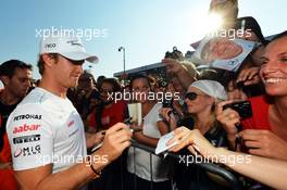 Nico Rosberg (GER) Mercedes AMG F1 signs autographs for the fans. 06.09.2012. Formula 1 World Championship, Rd 13, Italian Grand Prix, Monza, Italy, Preparation Day