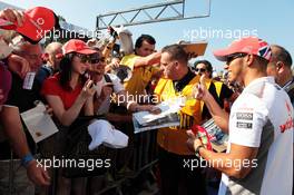 Lewis Hamilton (GBR) McLaren signs autographs for the fans. 06.09.2012. Formula 1 World Championship, Rd 13, Italian Grand Prix, Monza, Italy, Preparation Day