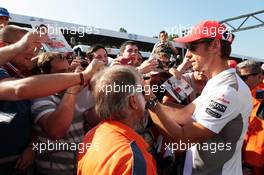 Jenson Button (GBR) McLaren signs autographs for the fans. 06.09.2012. Formula 1 World Championship, Rd 13, Italian Grand Prix, Monza, Italy, Preparation Day