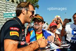 Jean-Eric Vergne (FRA) Scuderia Toro Rosso signs autographs for the fans. 06.09.2012. Formula 1 World Championship, Rd 13, Italian Grand Prix, Monza, Italy, Preparation Day
