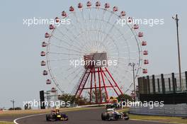 Mark Webber (AUS) Red Bull Racing RB8 and Sergio Perez (MEX) Sauber C31. 05.10.2012. Formula 1 World Championship, Rd 15, Japanese Grand Prix, Suzuka, Japan, Practice Day.