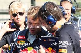 (L to R): Sebastian Vettel (GER) Red Bull Racing with Guillaume Rocquelin  (ITA) Red Bull Racing Race Engineer on the grid. 07.10.2012. Formula 1 World Championship, Rd 15, Japanese Grand Prix, Suzuka, Japan, Race Day.