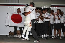 Kamui Kobayashi (JPN) Sauber celebrates his third position with Beat Zehnder (SUI) Sauber F1 Team Manager and the team. 07.10.2012. Formula 1 World Championship, Rd 15, Japanese Grand Prix, Suzuka, Japan, Race Day.