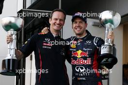 Race winner Sebastian Vettel (GER) Red Bull Racing celebrates on the podium with Paul Monaghan (GBR) Red Bull Racing Chief Engineer. 07.10.2012. Formula 1 World Championship, Rd 15, Japanese Grand Prix, Suzuka, Japan, Race Day.