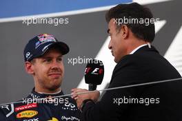 Race winner Sebastian Vettel (GER) Red Bull Racing on the podium with Jean Alesi (FRA). 07.10.2012. Formula 1 World Championship, Rd 15, Japanese Grand Prix, Suzuka, Japan, Race Day.