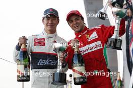 (L to R): Kamui Kobayashi (JPN) Sauber celebrates his third position on the podium with second placed Felipe Massa (BRA) Ferrari. 07.10.2012. Formula 1 World Championship, Rd 15, Japanese Grand Prix, Suzuka, Japan, Race Day.