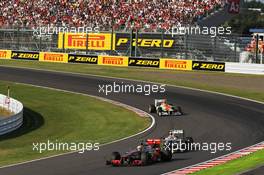 Lewis Hamilton (GBR) McLaren MP4/27 leads Sergio Perez (MEX) Sauber C31. 07.10.2012. Formula 1 World Championship, Rd 15, Japanese Grand Prix, Suzuka, Japan, Race Day.
