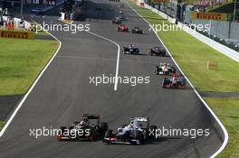 (L to R): Kimi Raikkonen (FIN) Lotus F1 E20 and Sergio Perez (MEX) Sauber C31 battle for position. 07.10.2012. Formula 1 World Championship, Rd 15, Japanese Grand Prix, Suzuka, Japan, Race Day.