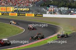 Sergio Perez (MEX) Sauber C31 runs wide after battling for position with Kimi Raikkonen (FIN) Lotus F1 E20. 07.10.2012. Formula 1 World Championship, Rd 15, Japanese Grand Prix, Suzuka, Japan, Race Day.