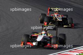 Narain Karthikeyan (IND) HRT Formula One Team HRT F112 leads Romain Grosjean (FRA) Lotus F1 E20. 07.10.2012. Formula 1 World Championship, Rd 15, Japanese Grand Prix, Suzuka, Japan, Race Day.