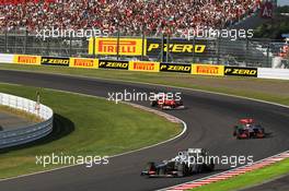 Kamui Kobayashi (JPN) Sauber C31 leads Jenson Button (GBR) McLaren MP4/27 and Felipe Massa (BRA) Ferrari F2012. 07.10.2012. Formula 1 World Championship, Rd 15, Japanese Grand Prix, Suzuka, Japan, Race Day.