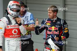 (L to R): Jenson Button (GBR) McLaren in parc ferme as Sebastian Vettel (GER) Red Bull Racing celebrates his pole position. 06.10.2012. Formula 1 World Championship, Rd 15, Japanese Grand Prix, Suzuka, Japan, Qualifying Day.