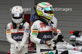 (L to R): Kamui Kobayashi (JPN) Sauber with team mate Sergio Perez (MEX) Sauber in parc ferme. 06.10.2012. Formula 1 World Championship, Rd 15, Japanese Grand Prix, Suzuka, Japan, Qualifying Day.