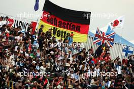 Fans in the grandstand. 06.10.2012. Formula 1 World Championship, Rd 15, Japanese Grand Prix, Suzuka, Japan, Qualifying Day.