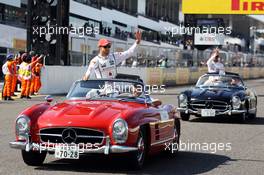 Jenson Button (GBR) McLaren and Lewis Hamilton (GBR) McLaren on the drivers parade. 07.10.2012. Formula 1 World Championship, Rd 15, Japanese Grand Prix, Suzuka, Japan, Race Day.