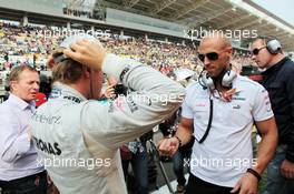 (L to R): Nico Rosberg (GER) Mercedes AMG F1 with Daniel Schloesser (GER) Personal Trainer on the grid. 14.10.2012. Formula 1 World Championship, Rd 16, Korean Grand Prix, Yeongam, South Korea, Race Day.