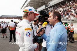 (L to R): Nico Hulkenberg (GER) Sahara Force India F1 with Kai Ebel (GER) RTL TV Presenter on the grid. 14.10.2012. Formula 1 World Championship, Rd 16, Korean Grand Prix, Yeongam, South Korea, Race Day.
