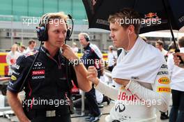 Christian Horner (GBR) Red Bull Racing Team Principal with Sebastian Vettel (GER) Red Bull Racing on the grid. 14.10.2012. Formula 1 World Championship, Rd 16, Korean Grand Prix, Yeongam, South Korea, Race Day.