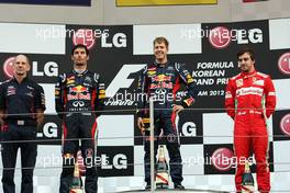 The podium (L to R): Mark Webber (AUS) Red Bull Racing, second; Sebastian Vettel (GER) Red Bull Racing, race winner; Fernando Alonso (ESP) Ferrari, third. 14.10.2012. Formula 1 World Championship, Rd 16, Korean Grand Prix, Yeongam, South Korea, Race Day.